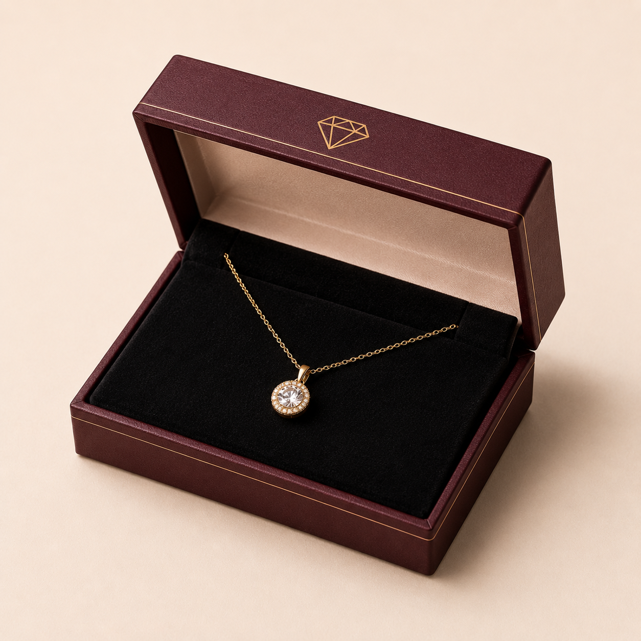 Foil-stamped custom necklace box with a gold chain draped over the open lid on velvet lining